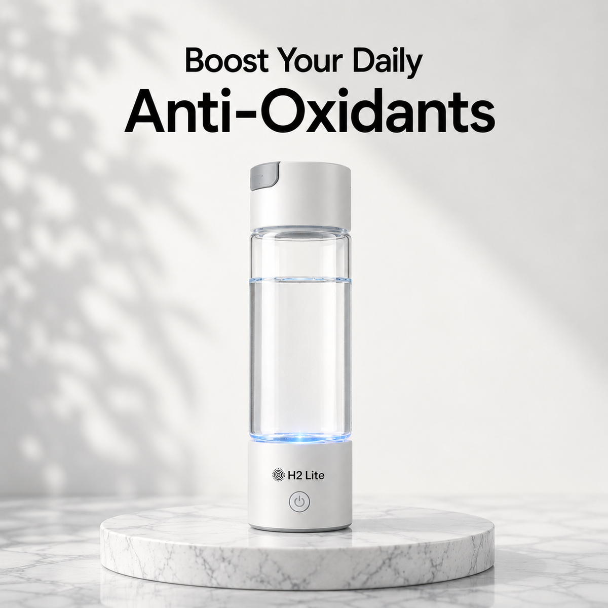 A H2 Lite portable water bottle with a clear body, white cap, and glowing blue LED base, displayed on a white marble pedestal with text reading 'Boost Your Daily Anti-Oxidants' above it.